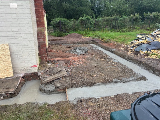 Concrete footings pumped and laid around a new base